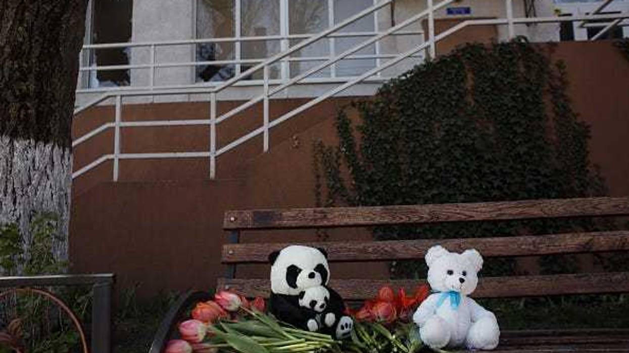 Residents lay toys and flowers in remembrance of Valeriya Galdan and her 3 month old daughter who died as a result of a rocket strike on a residential building on April 24, 2022 in Odessa, Ukraine.