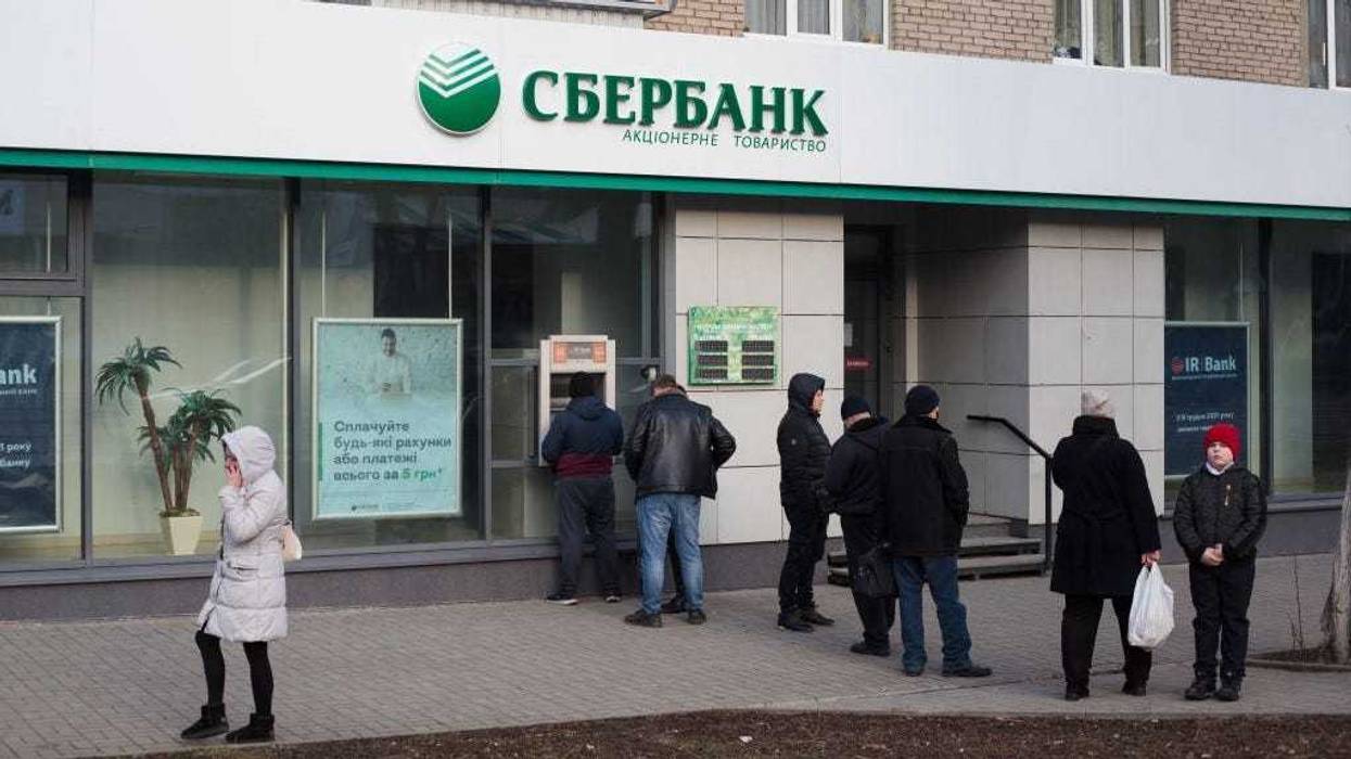 Residents wait in line at an ATM of Russian bank Sberbank on February 24, 2022 in Kramatorsk, Ukraine.