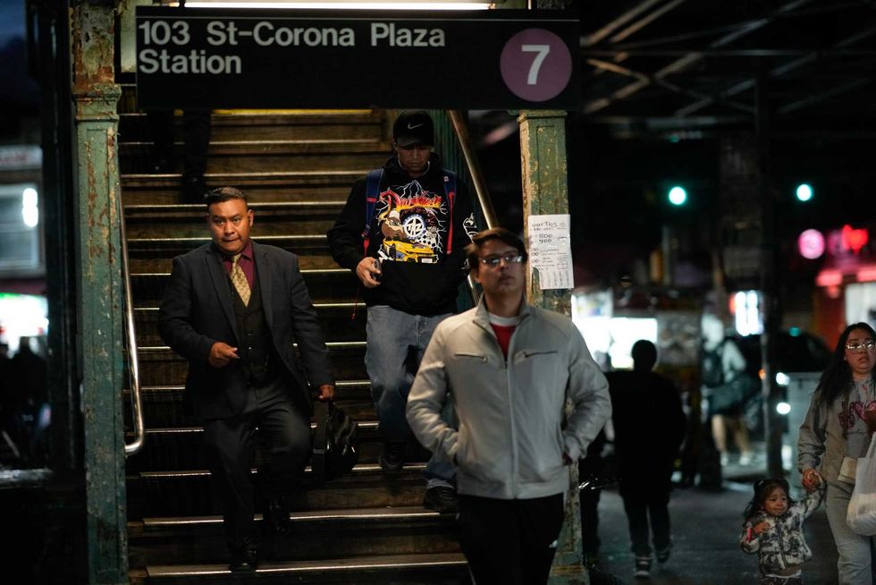 Residents walk from the 7 train as the mayor announced the operation on Oct. 15, 2024
