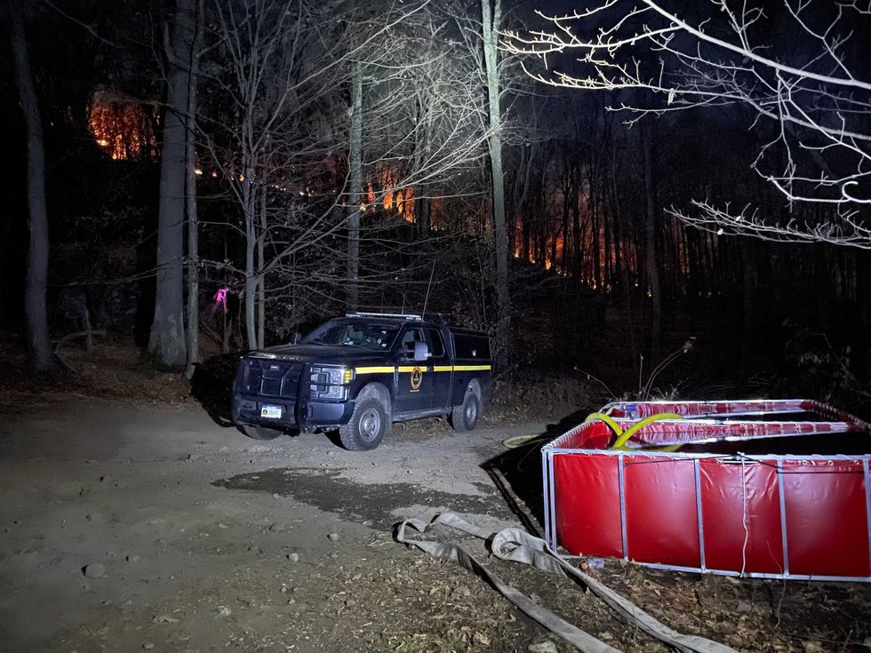 Responder truck and water as officials tackle the Jennings Creek wildfire in New York on Nov. 17, 2024.