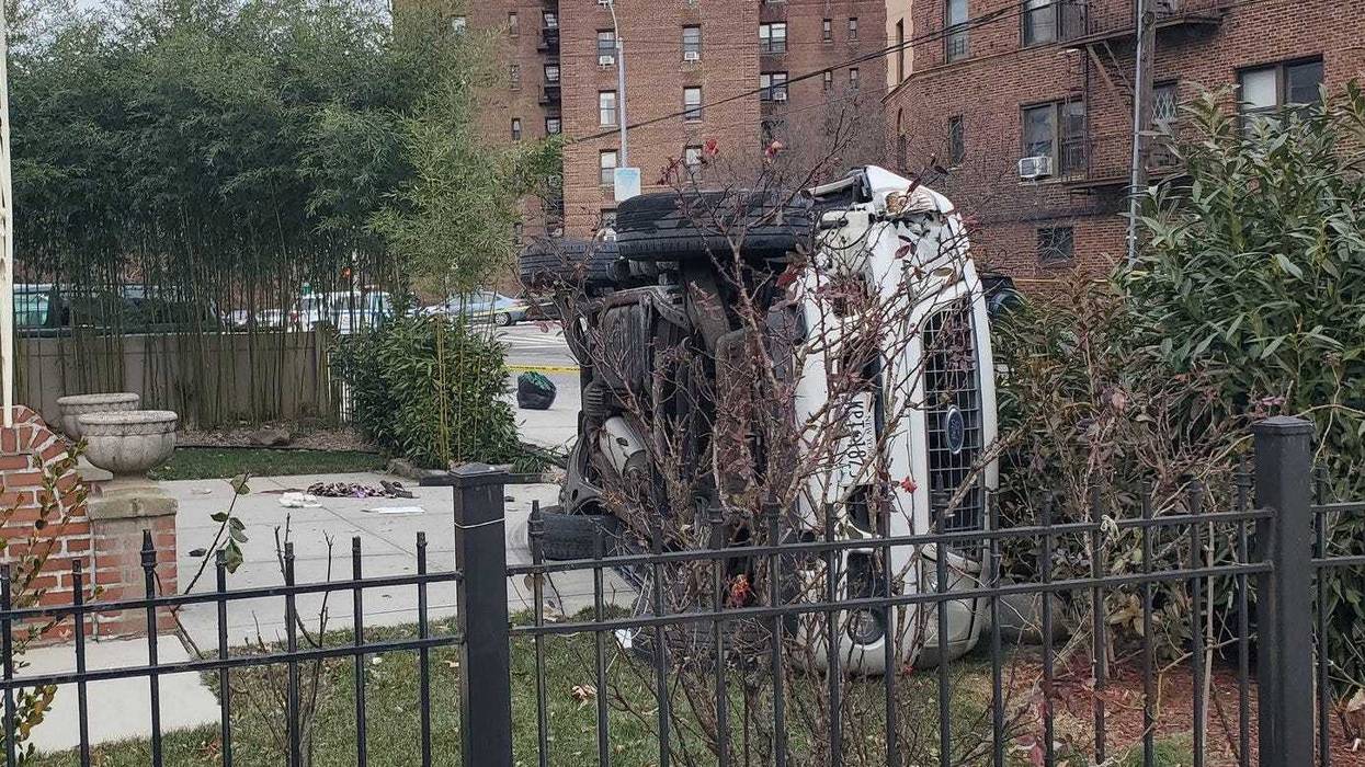 Responding officers found the SUV flipped on its side in front of a house and the mother critically injured at the scene in Flushing