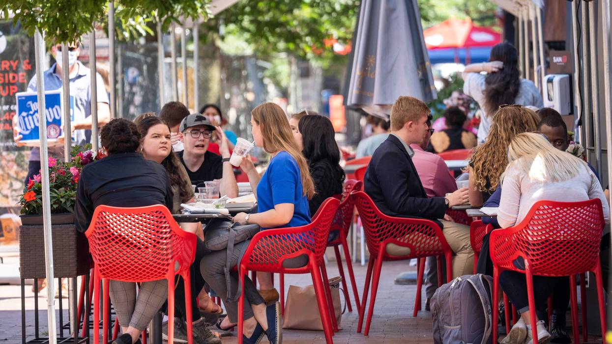 Restaurant patrons eat outside during lunch hour on Pennsylvania Avenue in the Capitol Hill neighborhood in Washington, D.C.