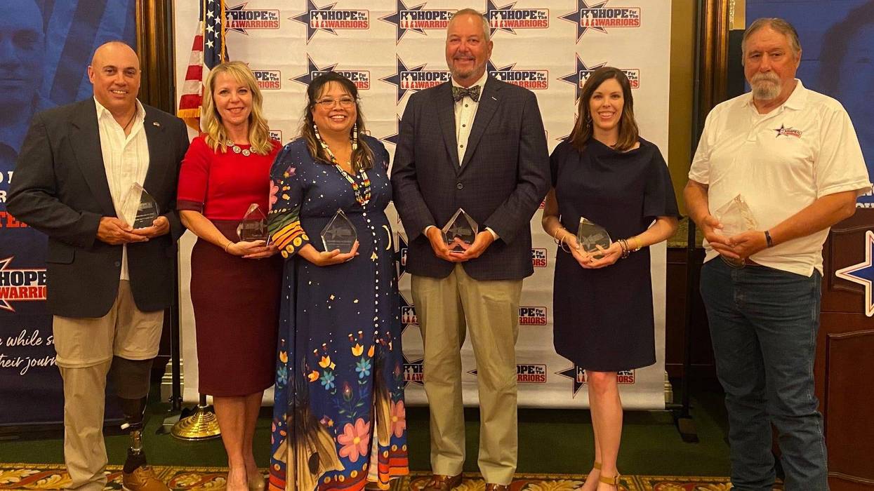Retired U.S. Army Sgt. Maj. Kevin Bittenbender, Georgia Van Gundy, Amanda Jacobs Ballard, Stirling Colins, Elizabeth Wilkins and John Phelps receive awards for their support with the nonprofit.