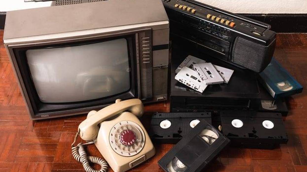 Retro phone, VCR, old tube TV, VHS cassettes