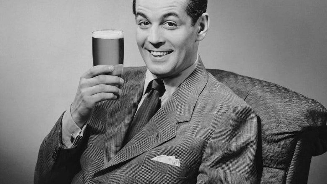 retro photo of man holding beer
