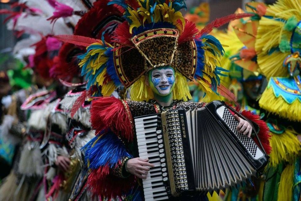 Revellers in fancy dress participate in the annual Mummers Parade in Philadelphia on January 2, 2022.