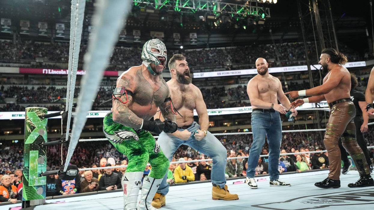 Rey Mysterio and Jason Kelce celebrating their win against Legado del Fantasma during Night One of WrestleMania 40 at Lincoln Financial Field on April 6, 2024 in Philadelphia.