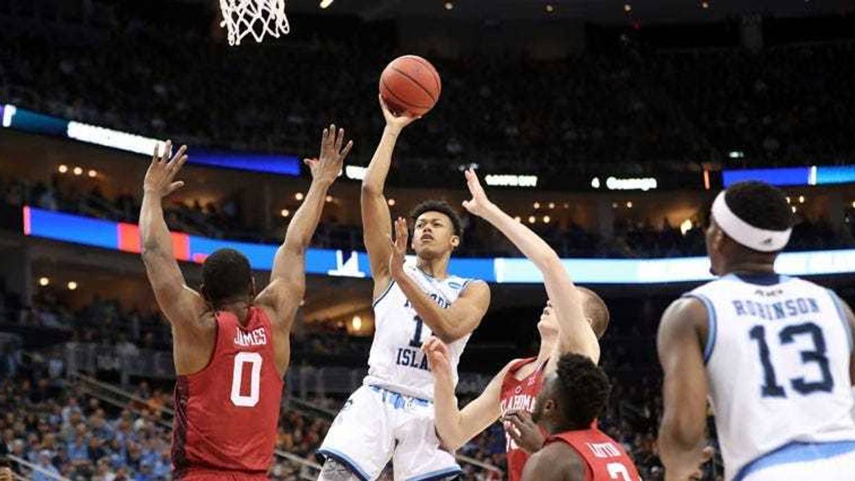 Rhode Island's Jeff Dowtin takes a shot against Oklahoma's Christian James on March 16, 2018, in the first round of the NCAA tournament at PPG Paints Arena in Pittsburgh.