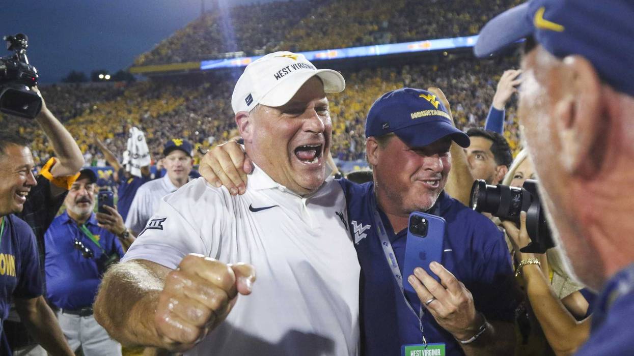Rich Rodriguez celebrates West Virginia win over Pitt