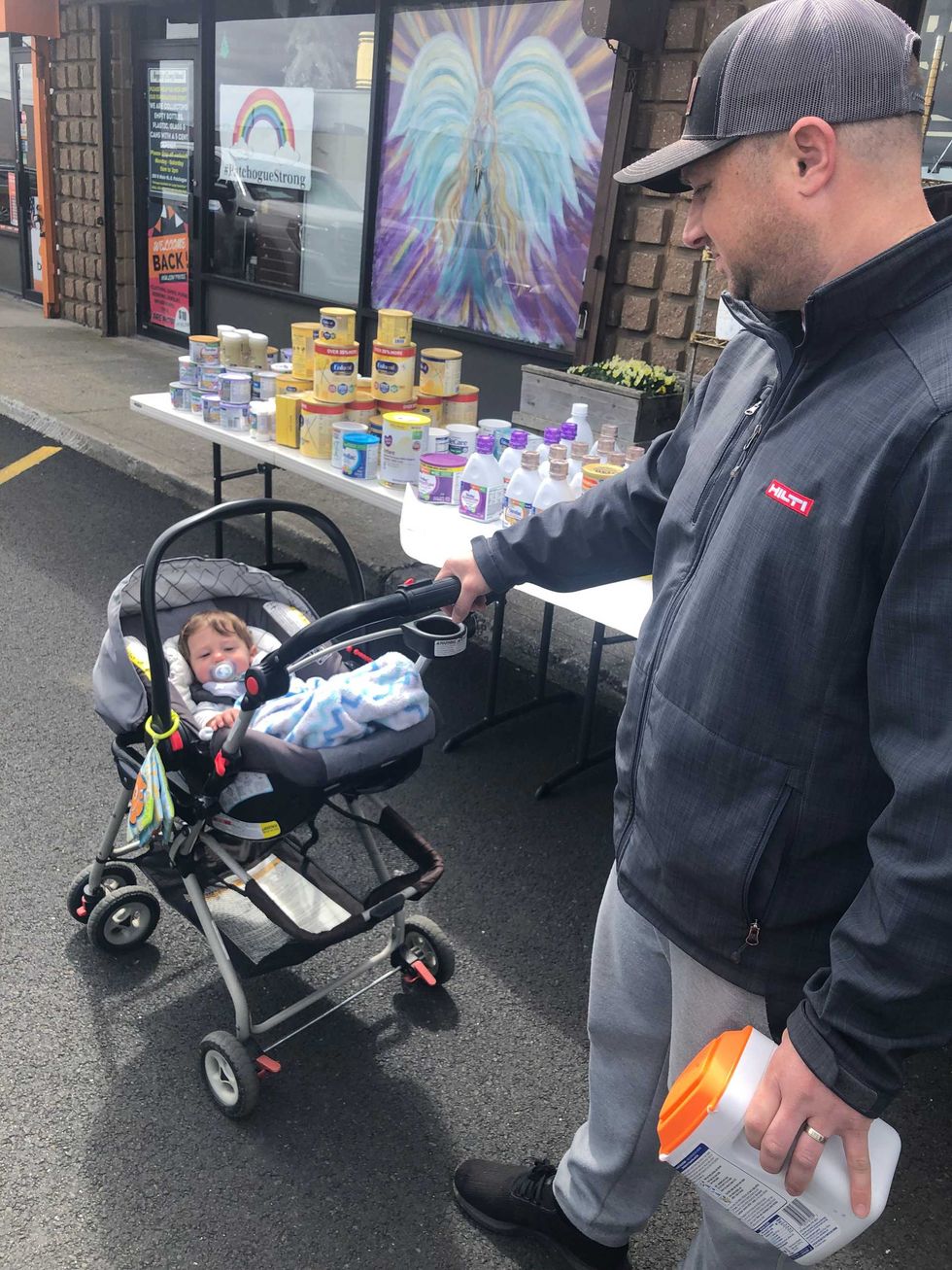 Rich Stack getting formula with his 8-month-old son, Chase