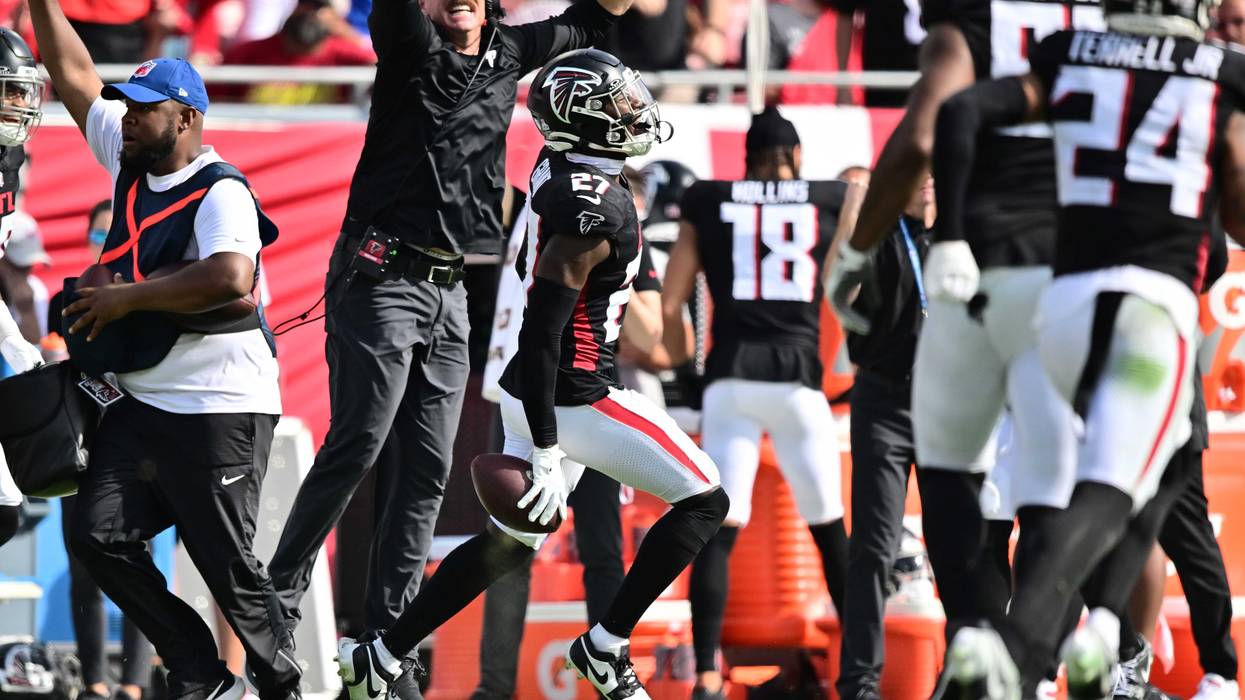 Richie Grant #27 of the Atlanta Falcons celebrates after intercepting a pass in the fourth quarter of the game against the Tampa Bay Buccaneers