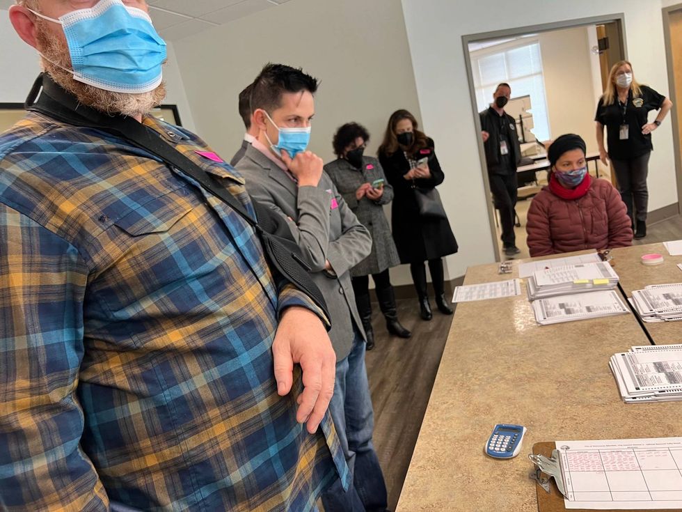 Richmond City Council candidate Cesar Zepeda observes the recount.