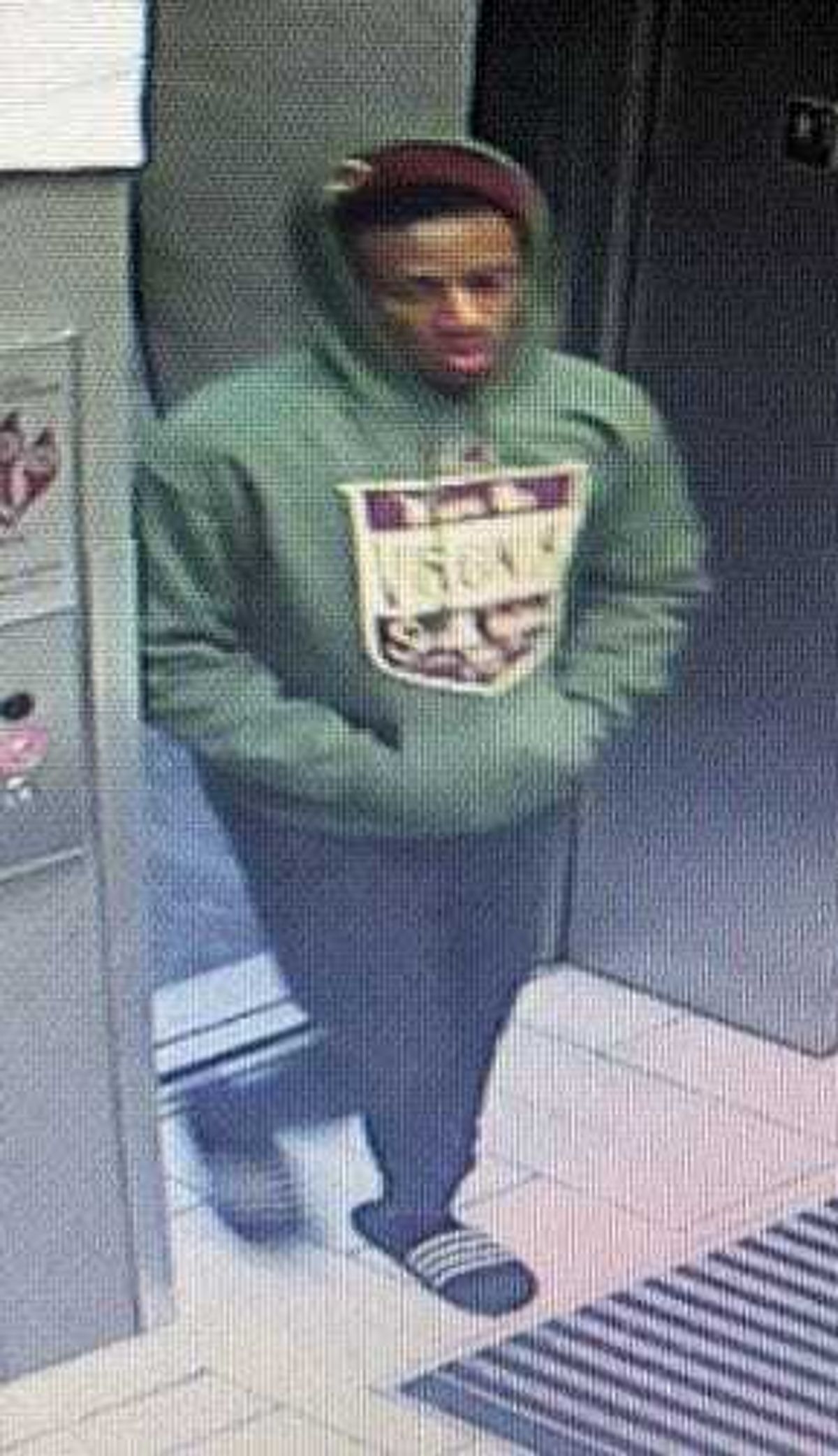 Richmond Police looking for suspect who stole an Amazon package from an apartment complex on Semmes Avenue on February 8 (Photo Credit: Richmond Police)