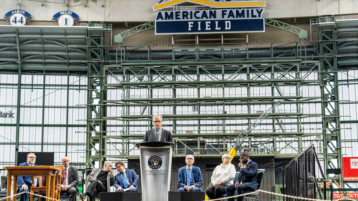 Rick Schlesinger, Milwaukee Brewers president of business operations, speaks as Gov. Tony Evers prepares to sign Assembly Bill 438 and Assembly Bill 439, a bipartisan package of bills passed by the Wisconsin State Legislature to keep the Milwaukee Brewers and Major League Baseball (MLB) in Wisconsin through 2050, on Tuesday December 5, 2023 at American Family Field in Milwaukee, Wis.