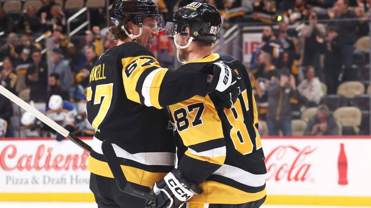 Rickard Rakell hugging Sidney Crosby