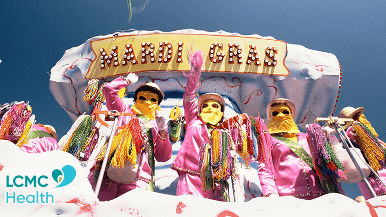 riders throwing beads from Mardi Gras parade