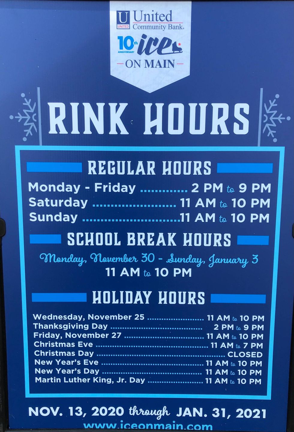Rink hours sign at the United Community Ice of Main open air ice rink