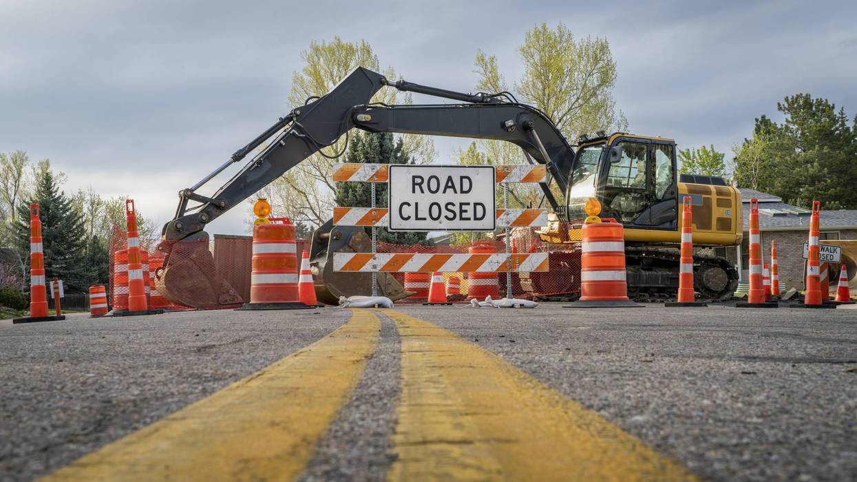 road closed - sign and barrier on a residential street for construction