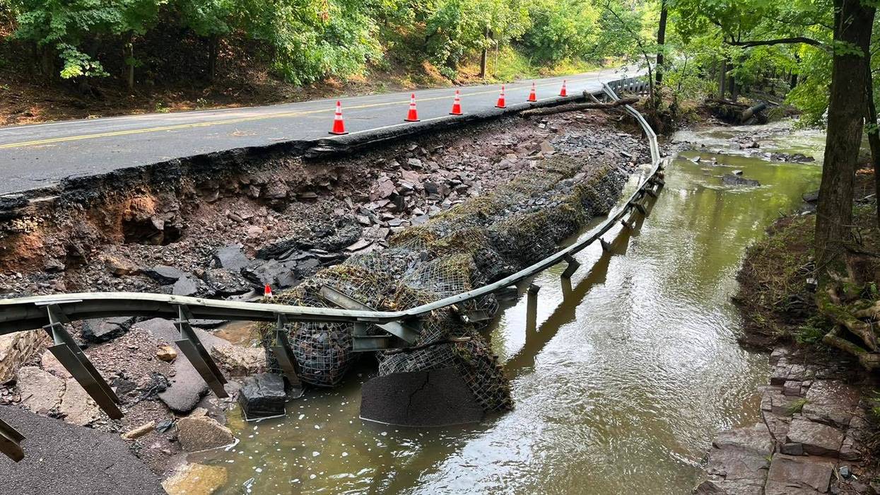 Road damage from flash flooding in Washington Crossing