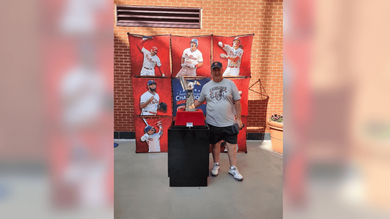 Rob Rickenbach with the 2022 National League Championship trophy.