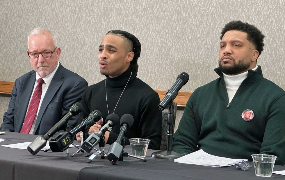 Robert Brooks Jr. speaks during a news conference as his lawyer Steve Schwarz, left, and Jared Ricks, listen in Rochester, N.Y., Wednesday, Jan. 15, 2024.