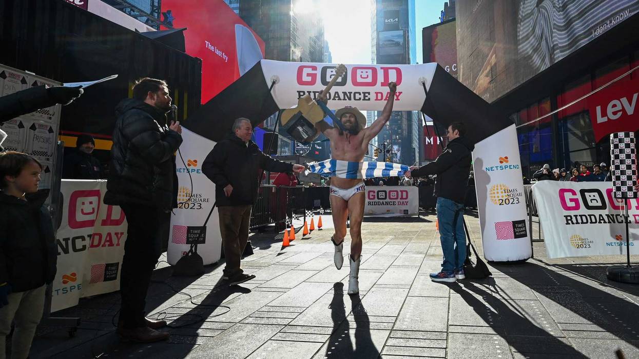 Robert John Burck, aka The Naked Cowboy, participates in the Good Riddance Day obstacle course in Times Square on December 28, 2022 in New York City. This year’s Good Riddance Day event gave participants the opportunity to race through the finish line in an obstacle course format.