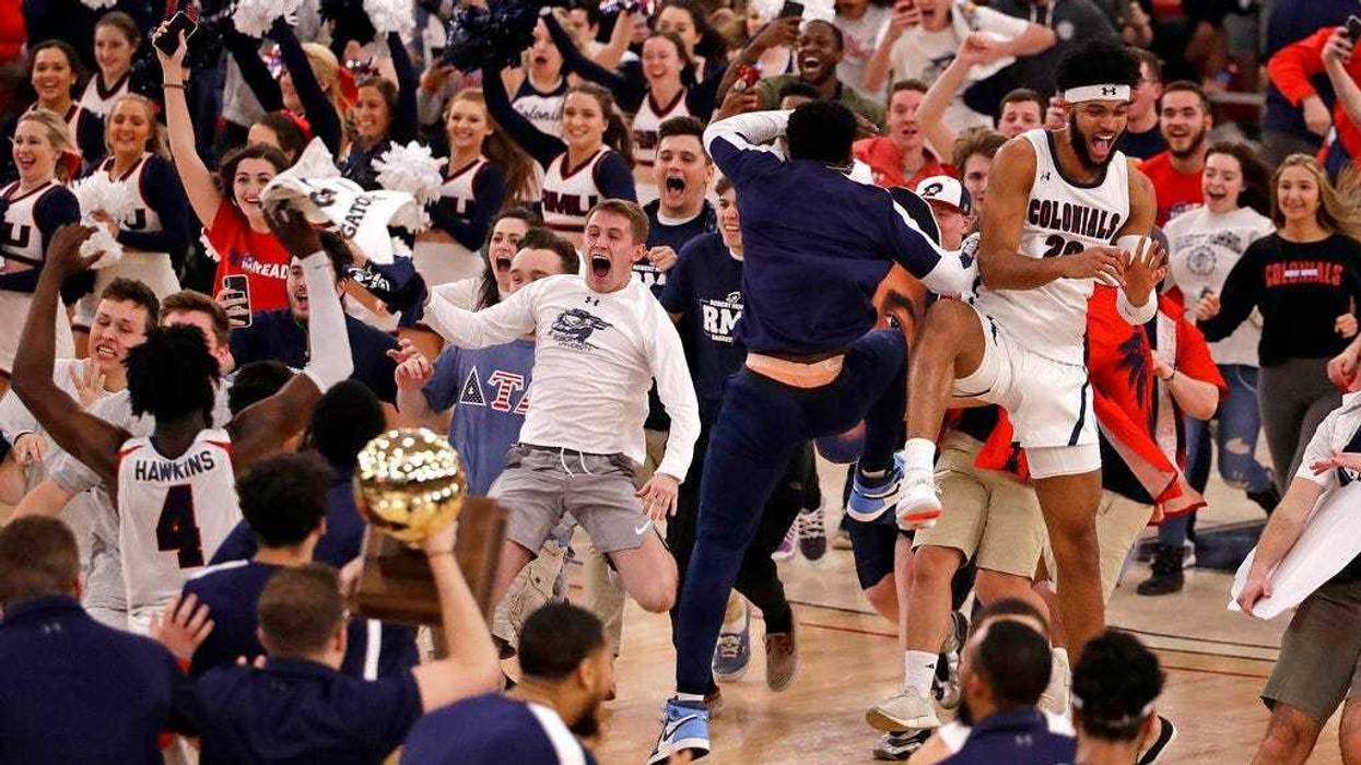 Robert Morris fans run onto the court as the team celebrates following a 77-67 win over St. Francis in an NCAA college basketball game for the Northeast Conference men's tournament championship in Pittsburgh, Tuesday, March 10, 2020.