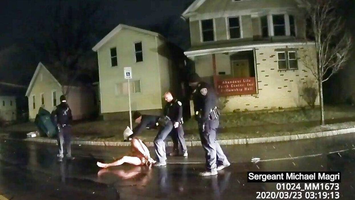 Rochester police officer puts a hood over the head of Daniel Prude (AP)