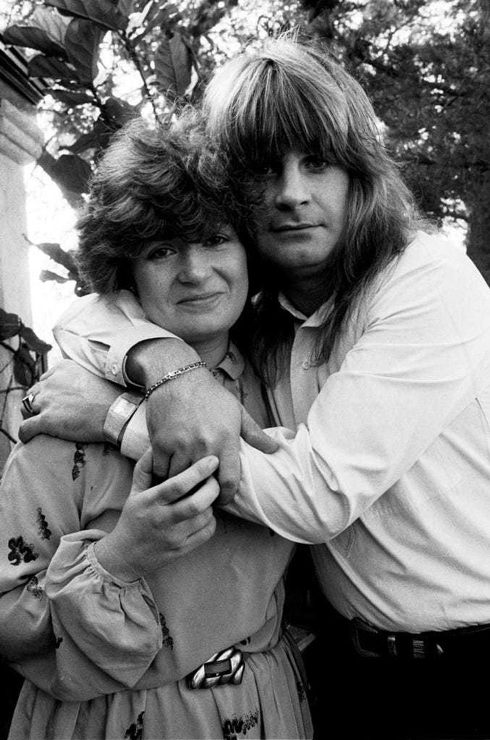 Rock musician Ozzy Osbourne embraces his fiancee, Sharon Arden, in Los Angeles, on Dec. 21, 1981.