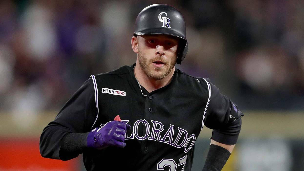Rockies shortstop Trevor Story rounds the bases after hitting a home run.