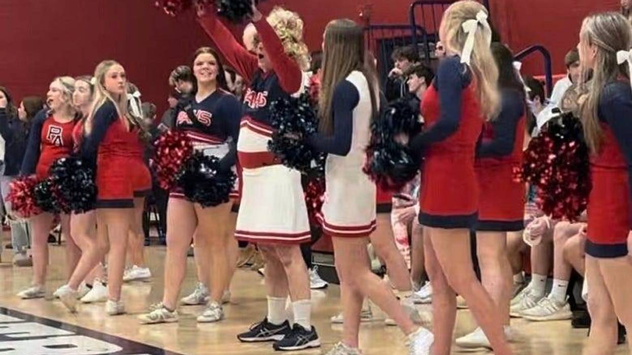 Rocky cheering with Pittston Area squad