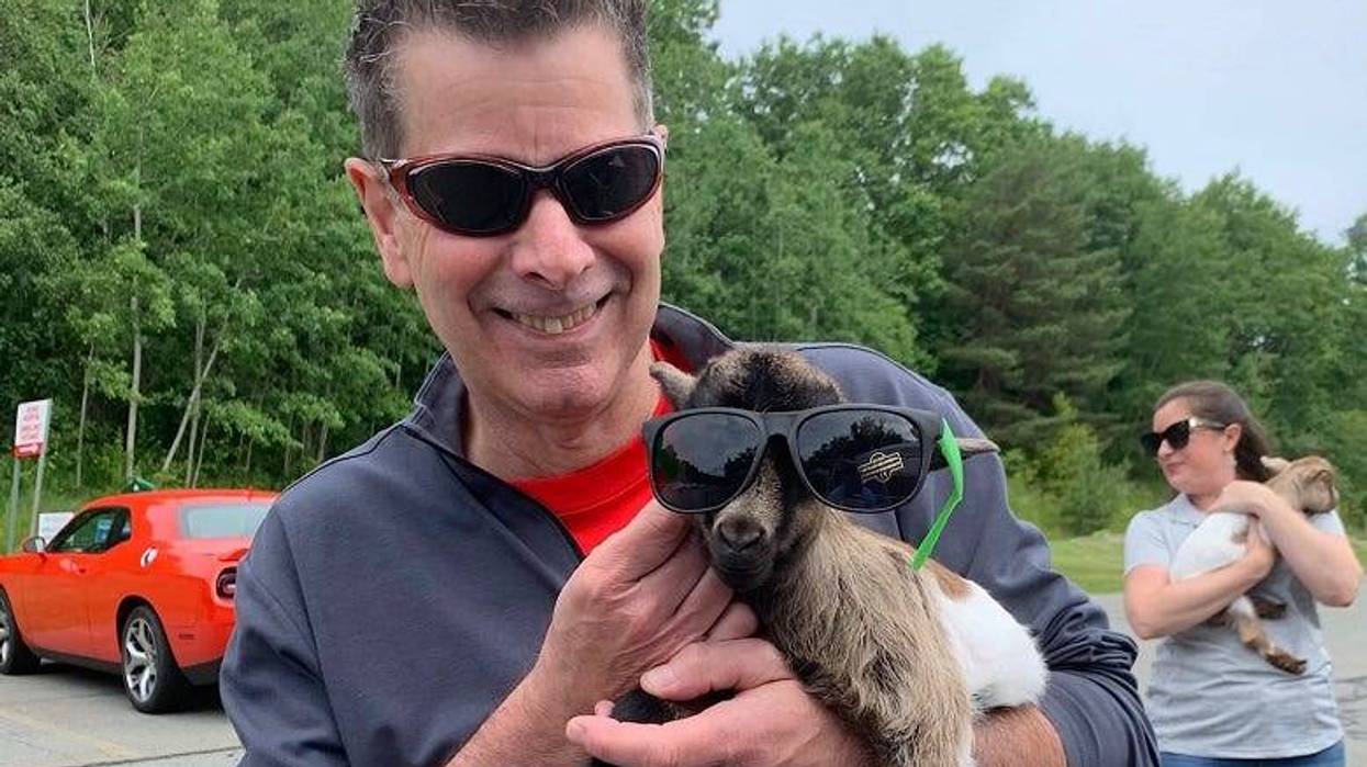 Rocky with a baby goat