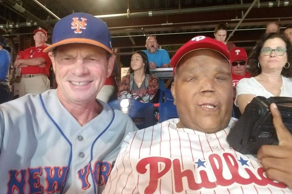 Rod Powell is shown at a Phillies game with his friend Steve.