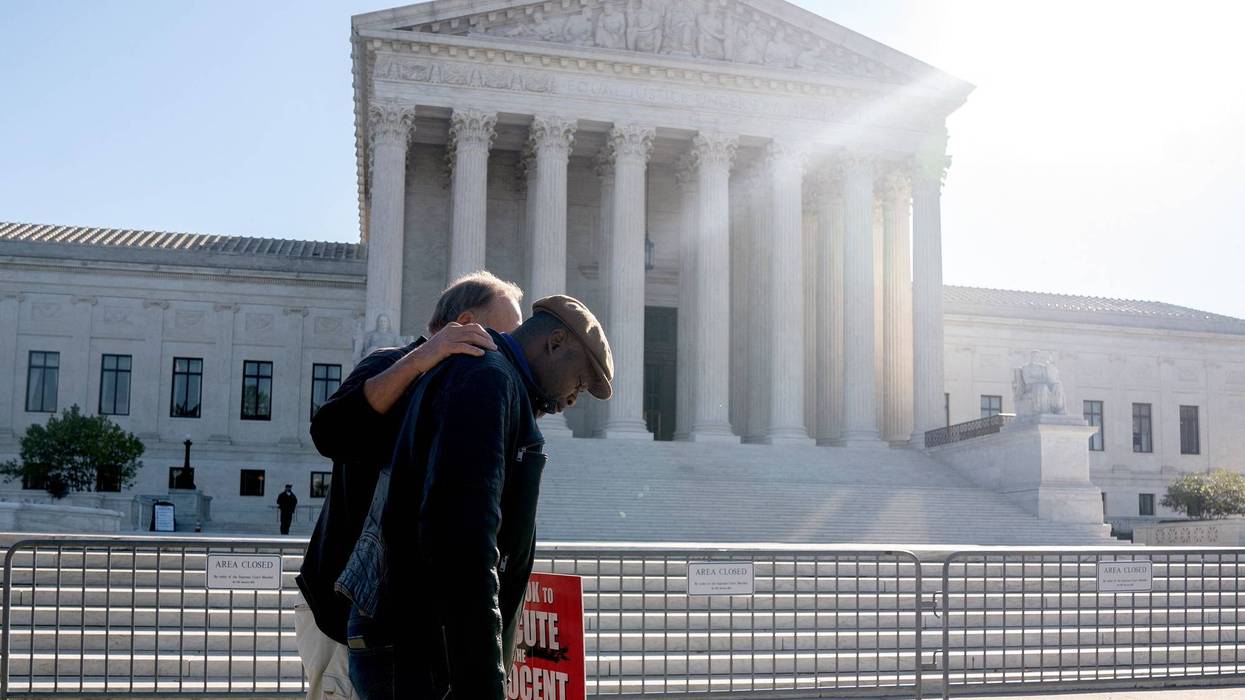 Roderick Reed, brother of Rodney Reed, walks with a supporter outside the US Supreme Court in Washington, DC, on October 11, 2022.