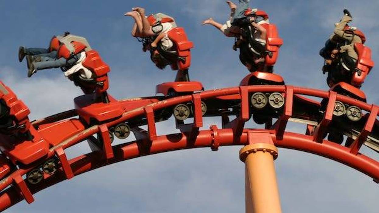Roller coaster hanging riders upside down