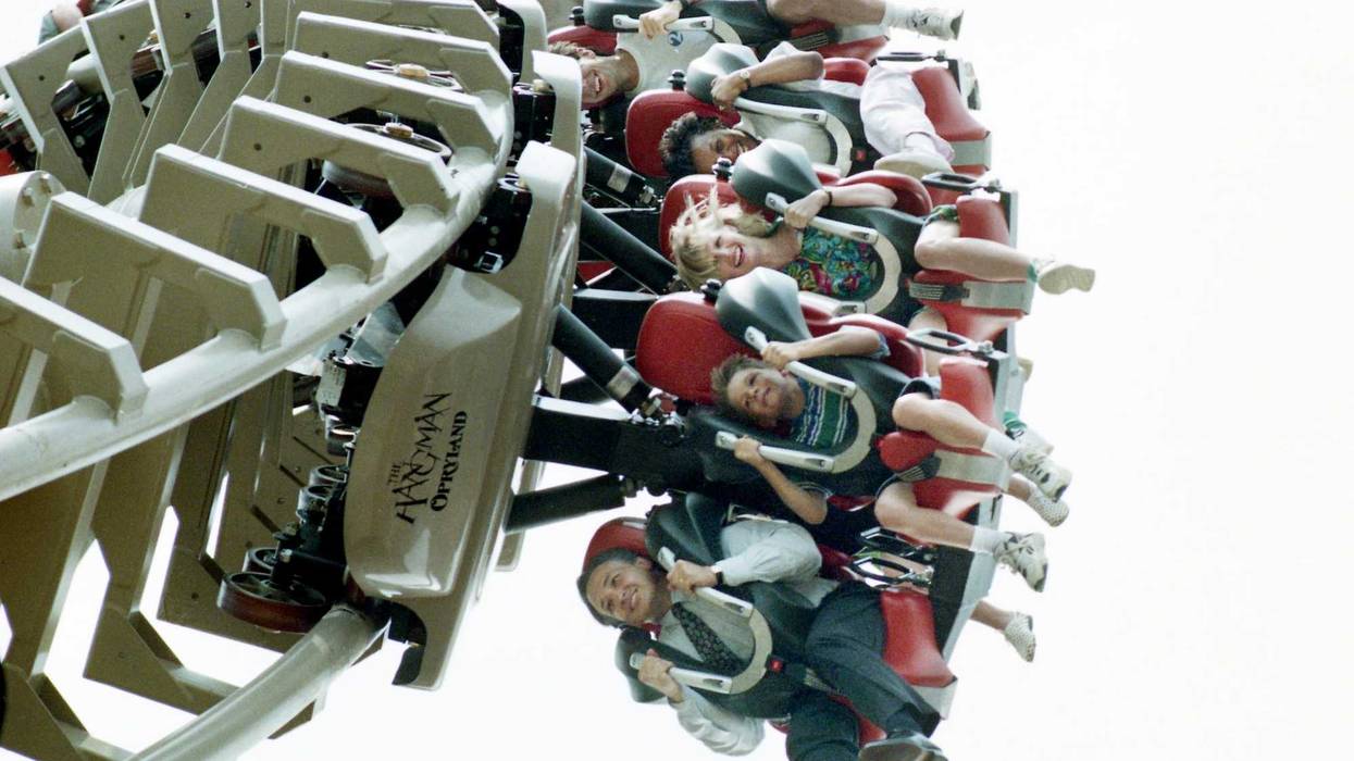 Roller coaster lovers are hanging on during the first few spins of the new Opryland U.S.A. theme park's Hangman on June 8, 1995. \"That's a real ride, that's not a baby ride,\" said country singer Chely Wright after she finished the open-air ride.