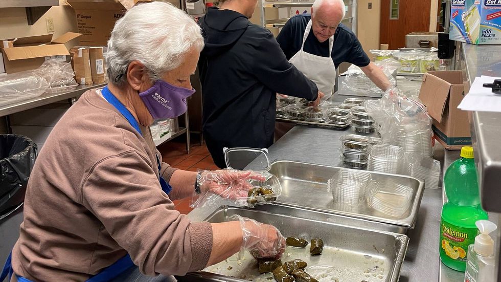 Rolling grape leaves in the kitchen at St. Nicholas Greek Orthodox Cathedral.
