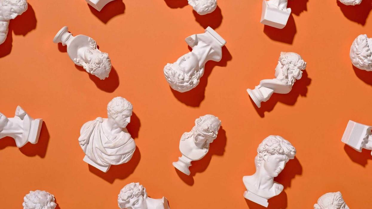 Roman busts on an orange background artwork.
