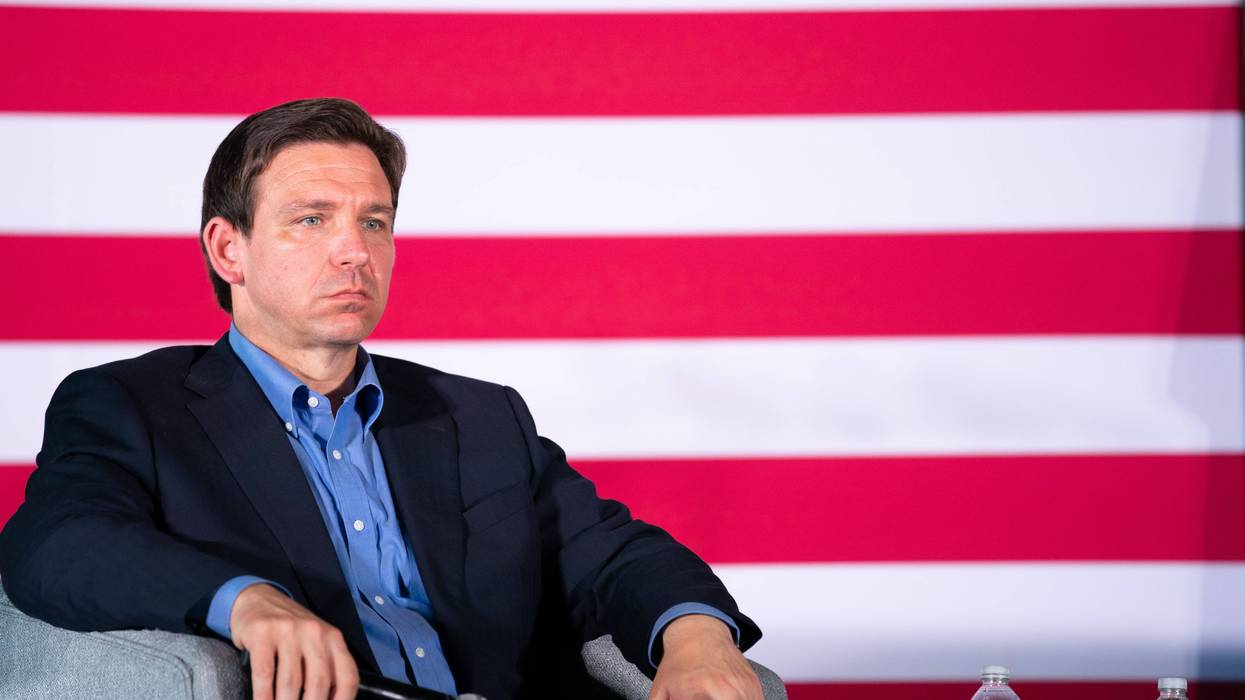 ron desantis sits onstage