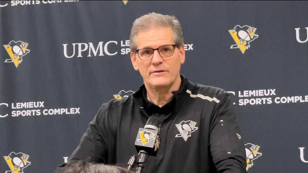 Ron Hextall at a podium