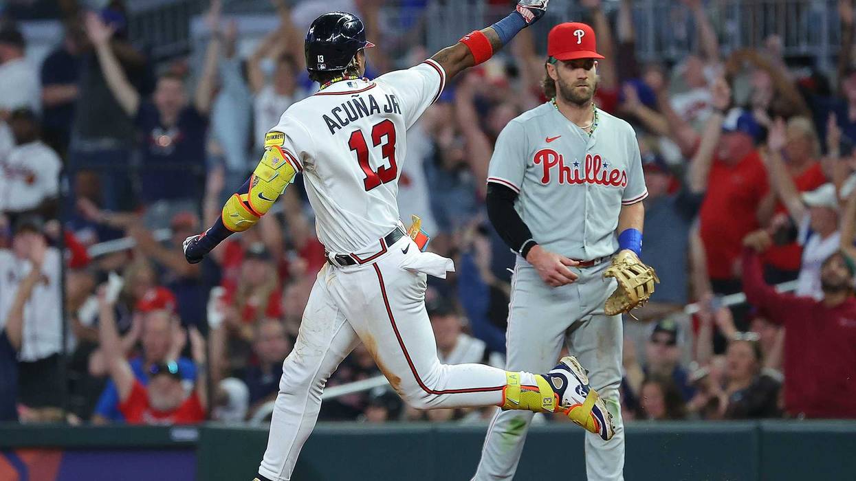 Ronald Acuna Jr. #13 of the Atlanta Braves reacts as he rounds first base after hitting his 39th home run of the season to lead off the sixth inning against the Philadelphia Phillies