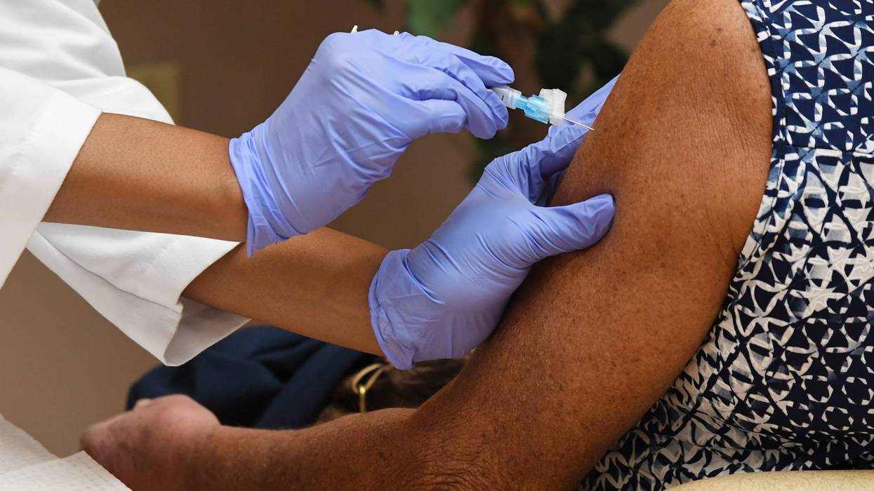 Roseman University Associate Professor of Pharmacy Practice Dr. Christina Madison administers a Moderna COVID-19 vaccination at the Doolittle Senior Center on February 3, 2021 in Las Vegas, Nevada.
