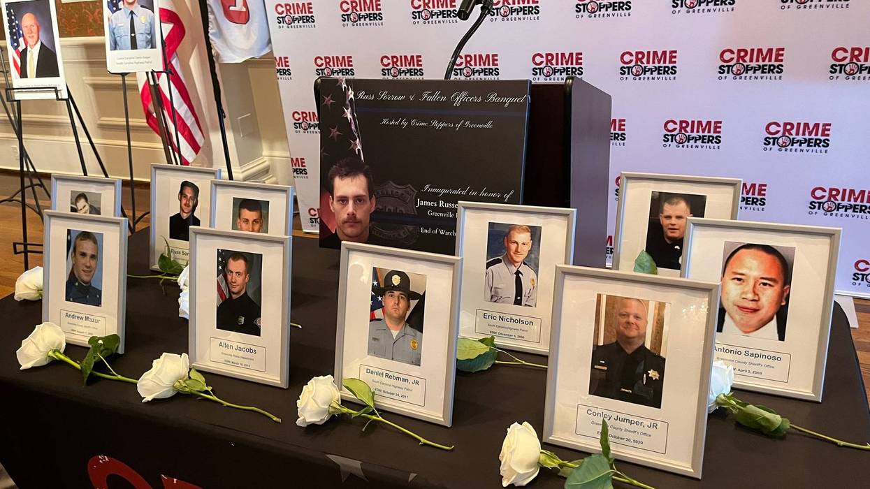 Roses laid in memory of fallen law enforcement personnel