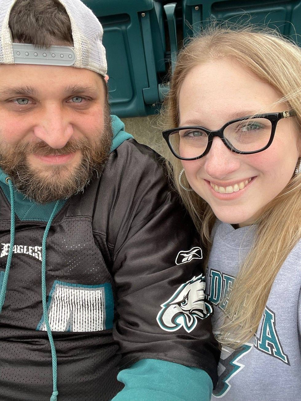 Ross Klinger and his wife Rebecca pose for a photo