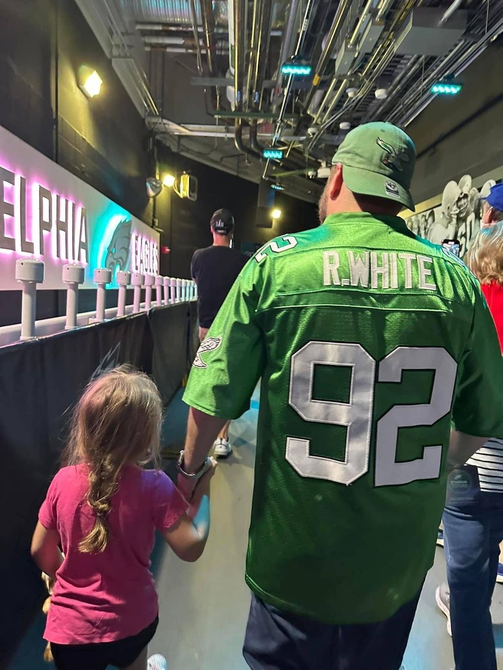 Ross Klinger walking on a tour of Lincoln Financial Field with his daughter, Shaina.