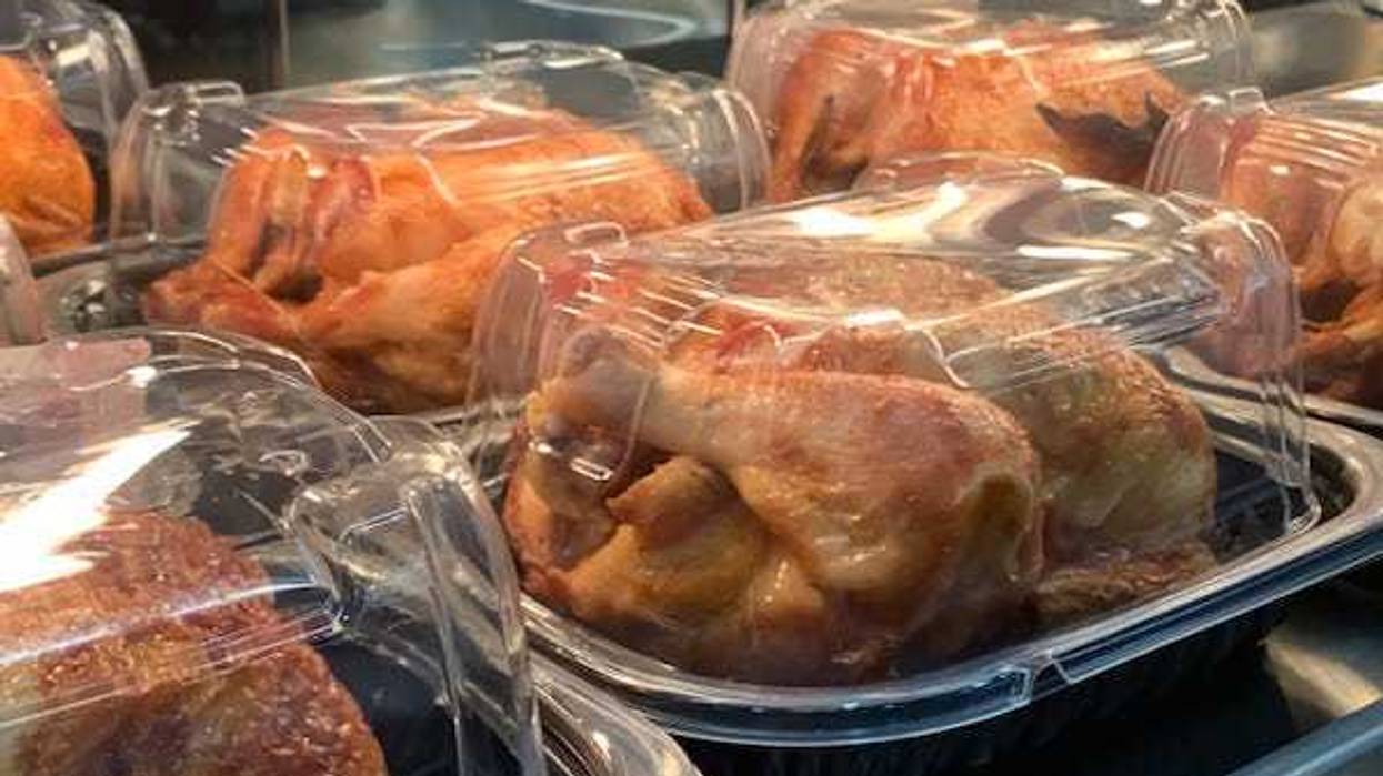 Rotisserie chickens on display in a store