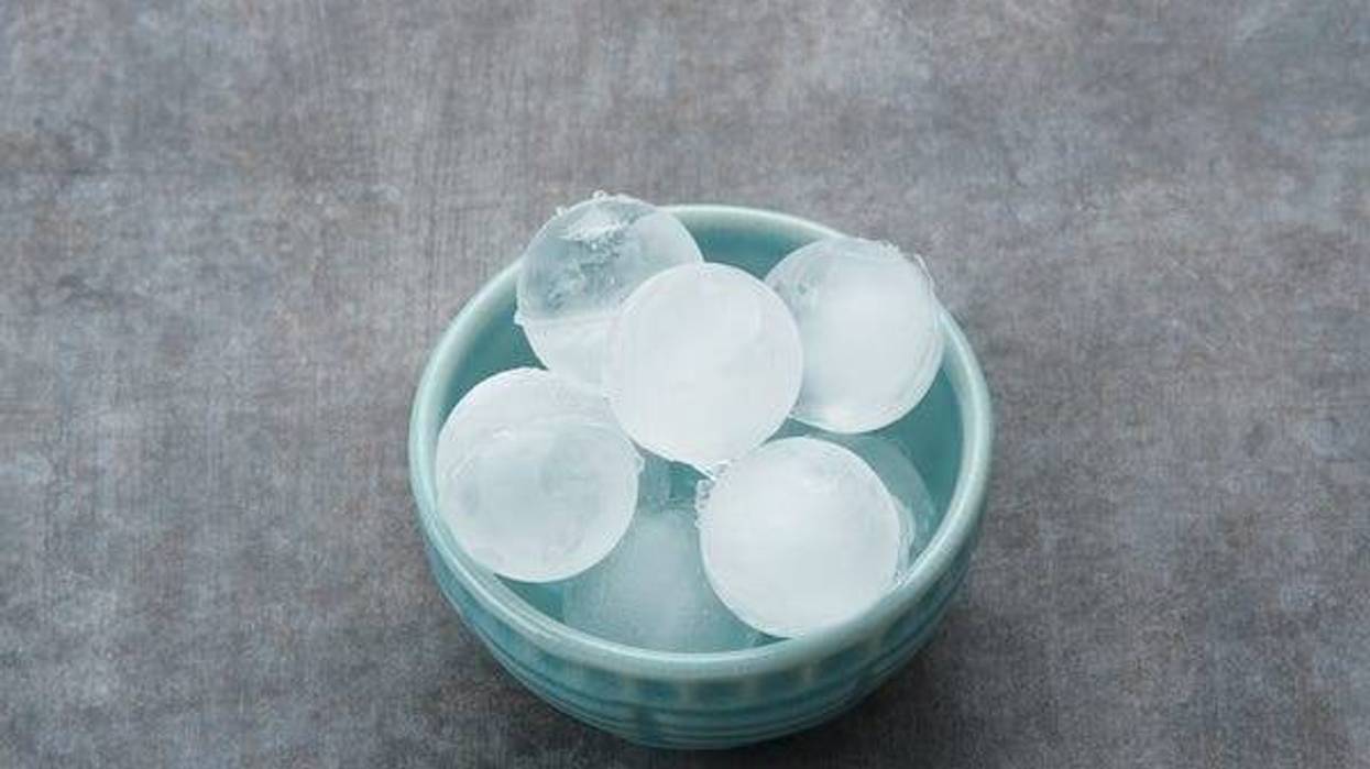 Round ice cubes in small bowl