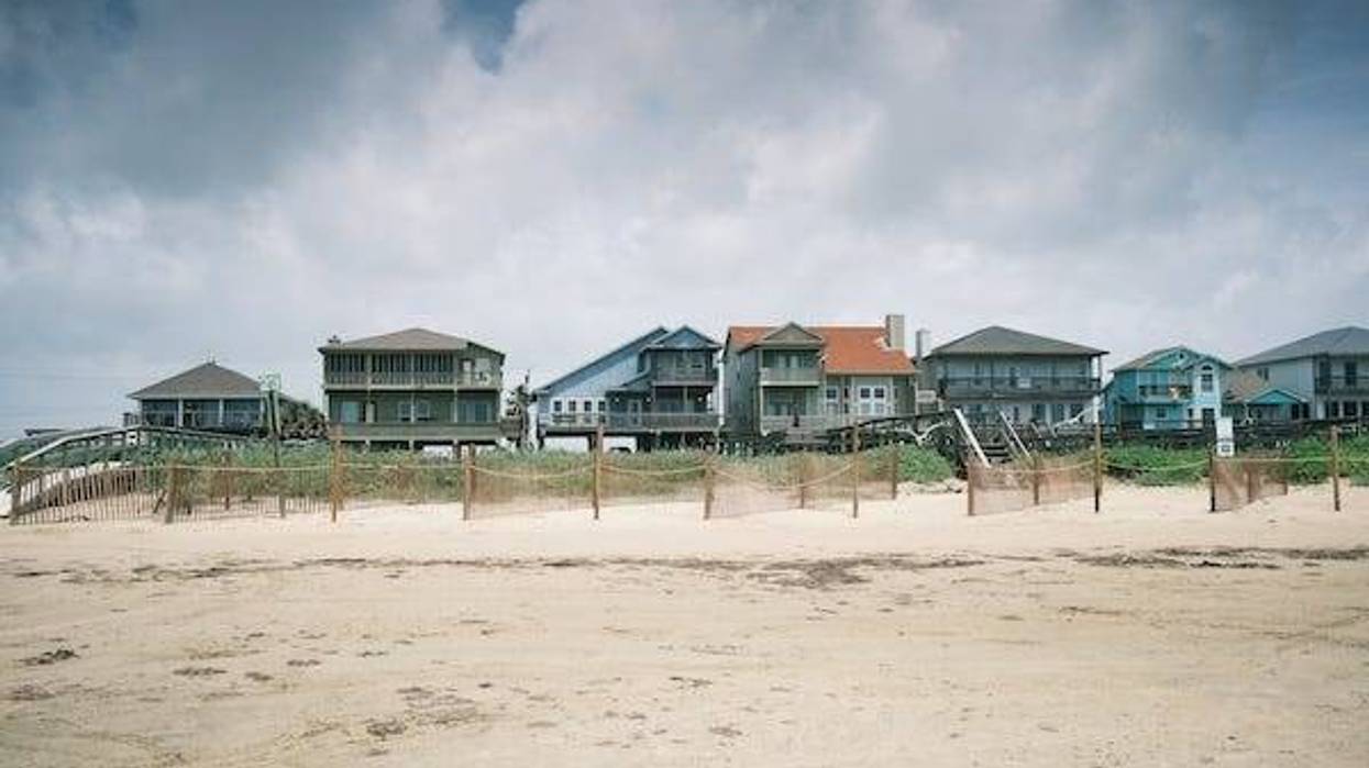 Row of beach houses along the coast of Galveston, TX