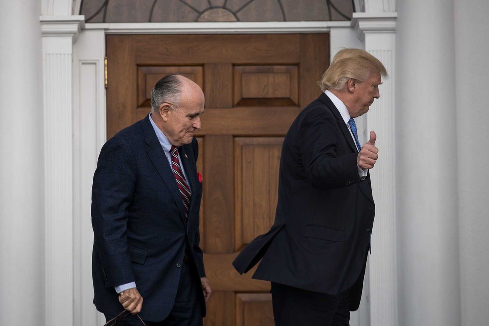 Rudy Giuliani andDonald Trump head into the clubhouse for their meeting at Trump International Golf Club, November 20, 2016 in Bedminster Township, New Jersey.