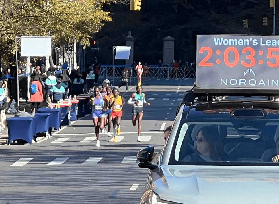 Runners making their way down Fifth Avenue in Harlem on Nov. 3, 2024, for the TCS New York City Marathon.